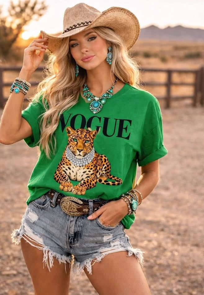 PREORDER Vogue Leopard Tee worn by a model in a cowboy hat and turquoise jewelry against a scenic background.