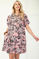 Floral oversized dress in pink with black and white print by Gigio, featuring pockets for added comfort.