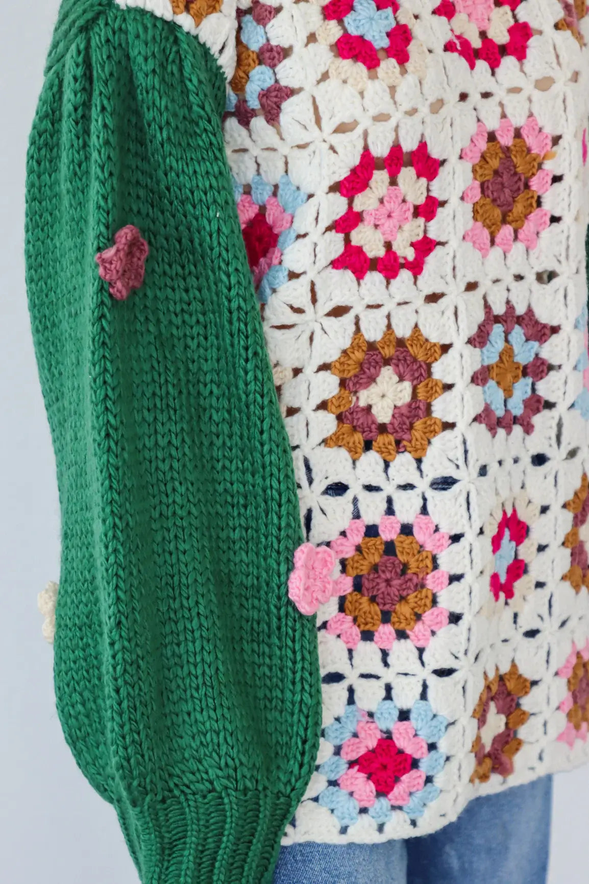 Square Up Sweater featuring boho floral patchwork and green sleeves with 3D crocheted flowers, by Listicle.