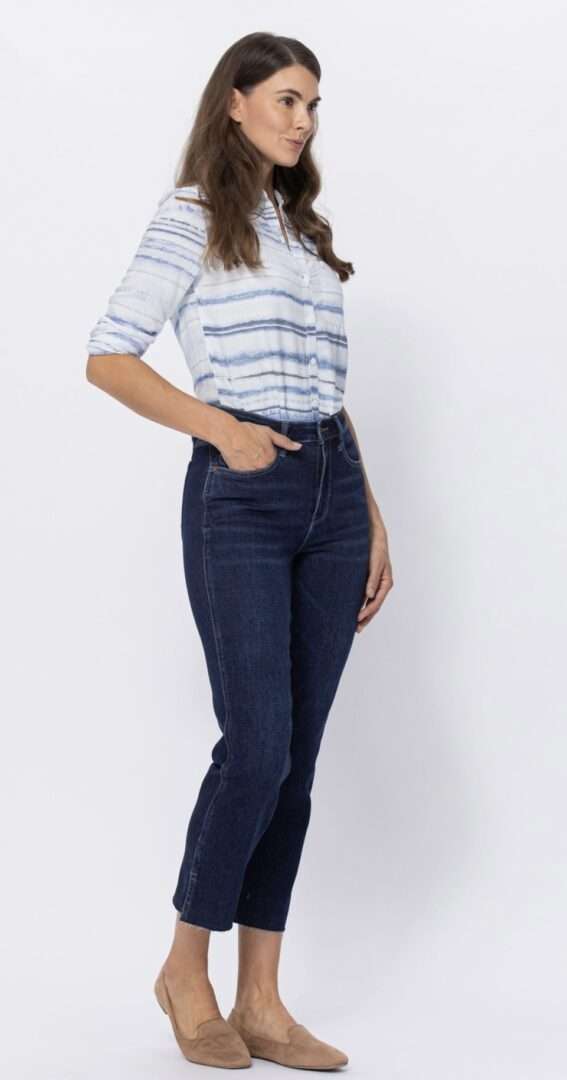Model wearing Judy Blue Joannie jeans, high-waisted dark wash cropped straight fit with a blue striped shirt.