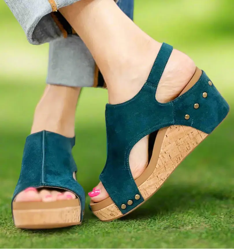 Teal faux suede wedges by Corkys, featuring a cork heel and comfortable design for stylish all-day wear.