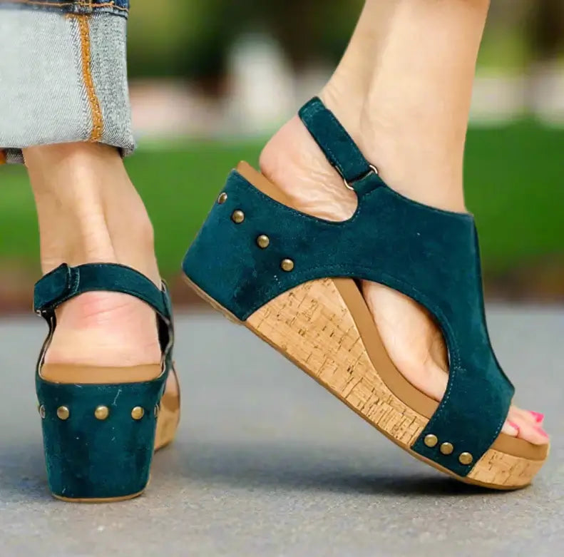 Teal faux suede wedge sandals with cork sole, perfect for stylish comfort in any season.