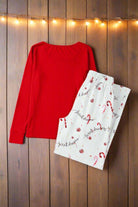 Sweet Dreams Candy Cane Pajamas with red top and candy cane print pants, perfect for holiday relaxation and comfort.