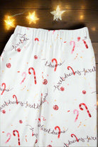 "Sweet Dreams Candy Cane Pajama Pants with festive holiday design and twinkling star lights"