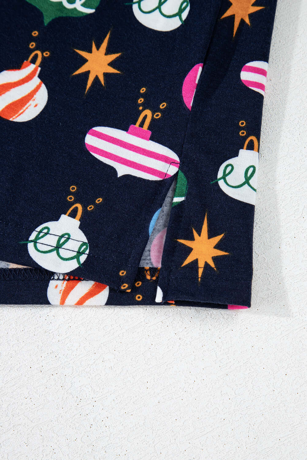 Close-up of festive decorations on BLUE CHRISTMAS WITHOUT YOU PJ's fabric by Vivian-Lu, featuring holiday ornaments and stars.