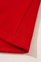 Close-up of the red long-sleeve of the SLEIGH GIRL SLEIGH PJ Set by Vivian-Lu, highlighting the soft fleece material.