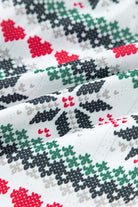 Close-up of festive snowflake fabric pattern in red, green, and black on the SLEIGH GIRL SLEIGH PJ Set by Vivian-Lu.