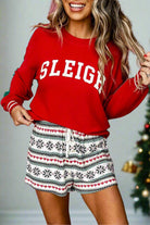 Festive holiday pajama set with red 'SLEIGH' top and snowflake print shorts, perfect for cozy Christmas lounging.