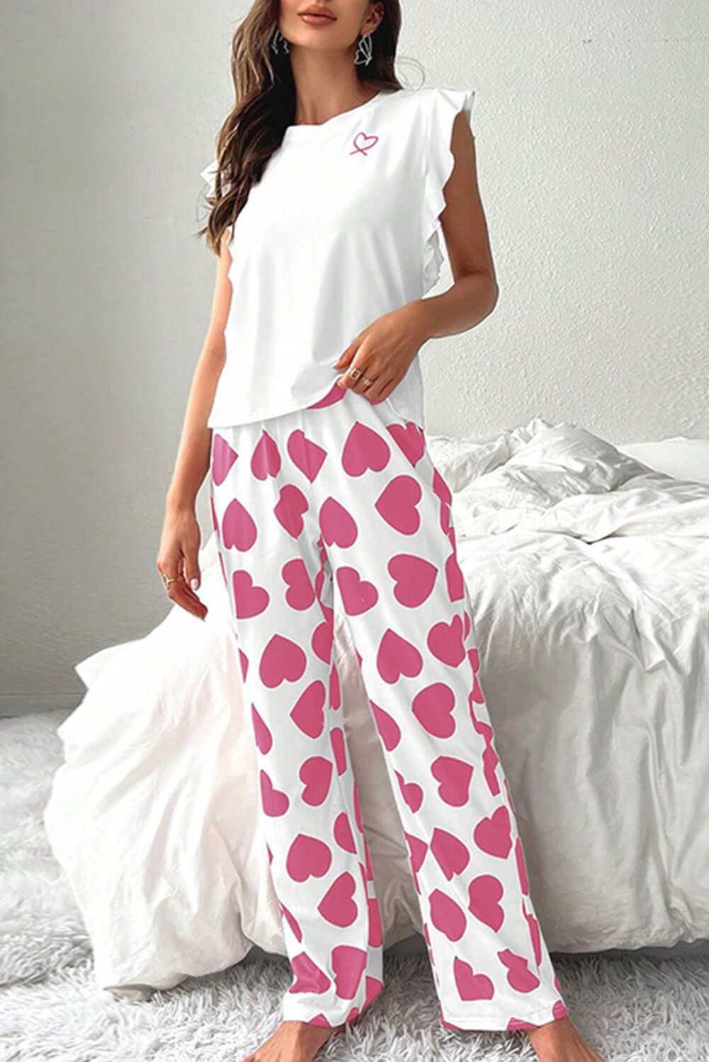 Love Language Lounge Set featuring a ruffled white tank top and pink heart-print lounge pants, perfect for cozy lounging.