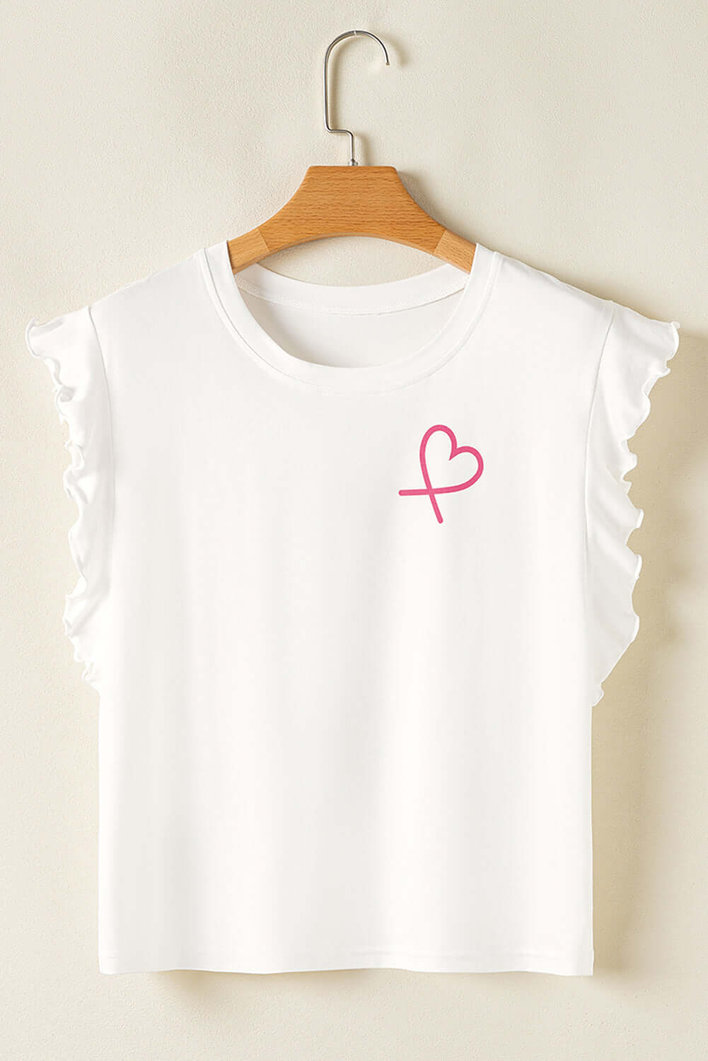 White ruffled sleeve top with pink heart graphic, perfect for casual or cozy outfits.