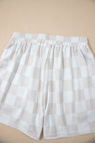 Light checkered shorts with an elastic waistband, perfect for casual lounging and weekend wear.