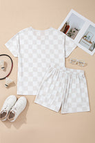 Weekend Check-In checkered two-piece lounge set featuring a V-neck top and drawstring shorts on a neutral background.