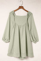 Sage green dress with square neckline, puffed sleeves, chevron pattern, and mini length for an elegant and romantic look.