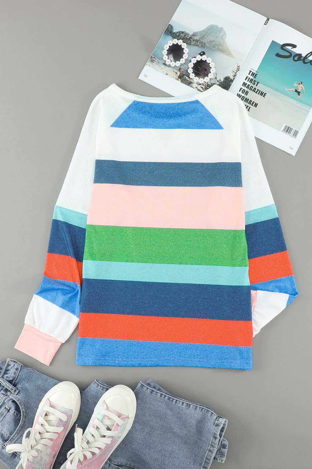 Color block top from Vivian-Lu featuring multicolor stripes, round neck, and raglan sleeves on a gray background.