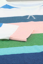 Color block top with round neck and raglan sleeves in pink, blue, green, and white, showcasing soft, breathable fabric.