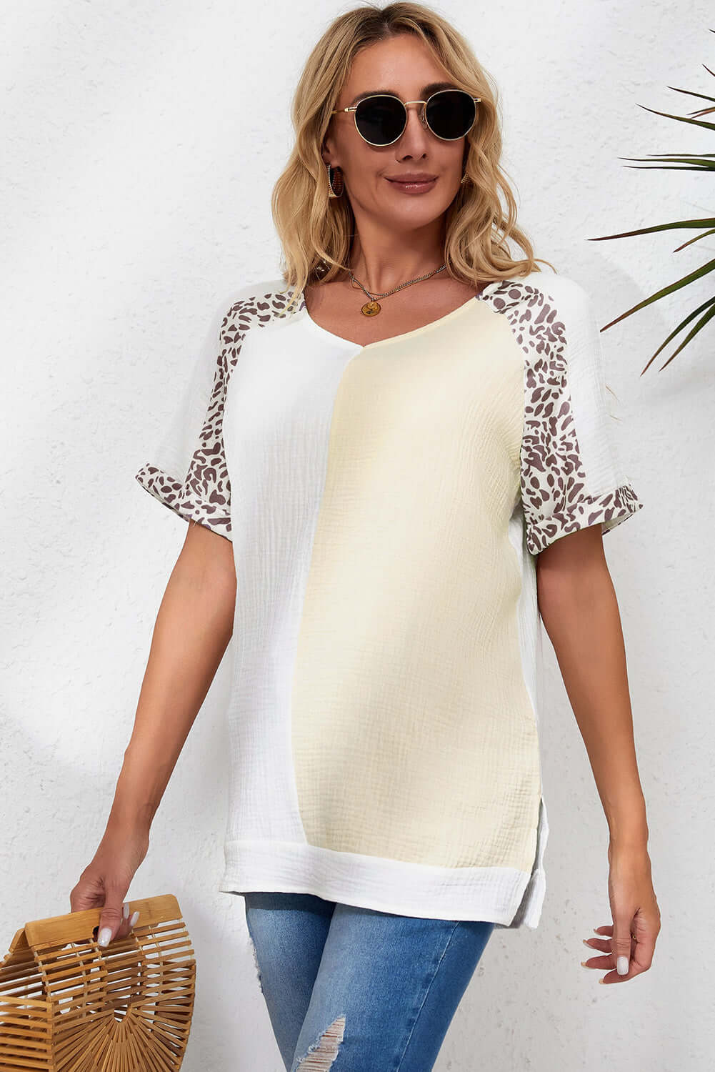 Trendy WILD TRACE TOP - Boutique Comfort & Style by Teal Tiger Boutique $25.00 Elevate your look with the WILD TRACE TOP. This trendy blouse features color block patchwork, leopard trim, and a flattering v-neckline for ultimate comfort. Teal Tiger Boutiqu