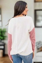 Cozy Contrasts Top featuring a textured knit with color block design, perfect for cooler days and casual wear.