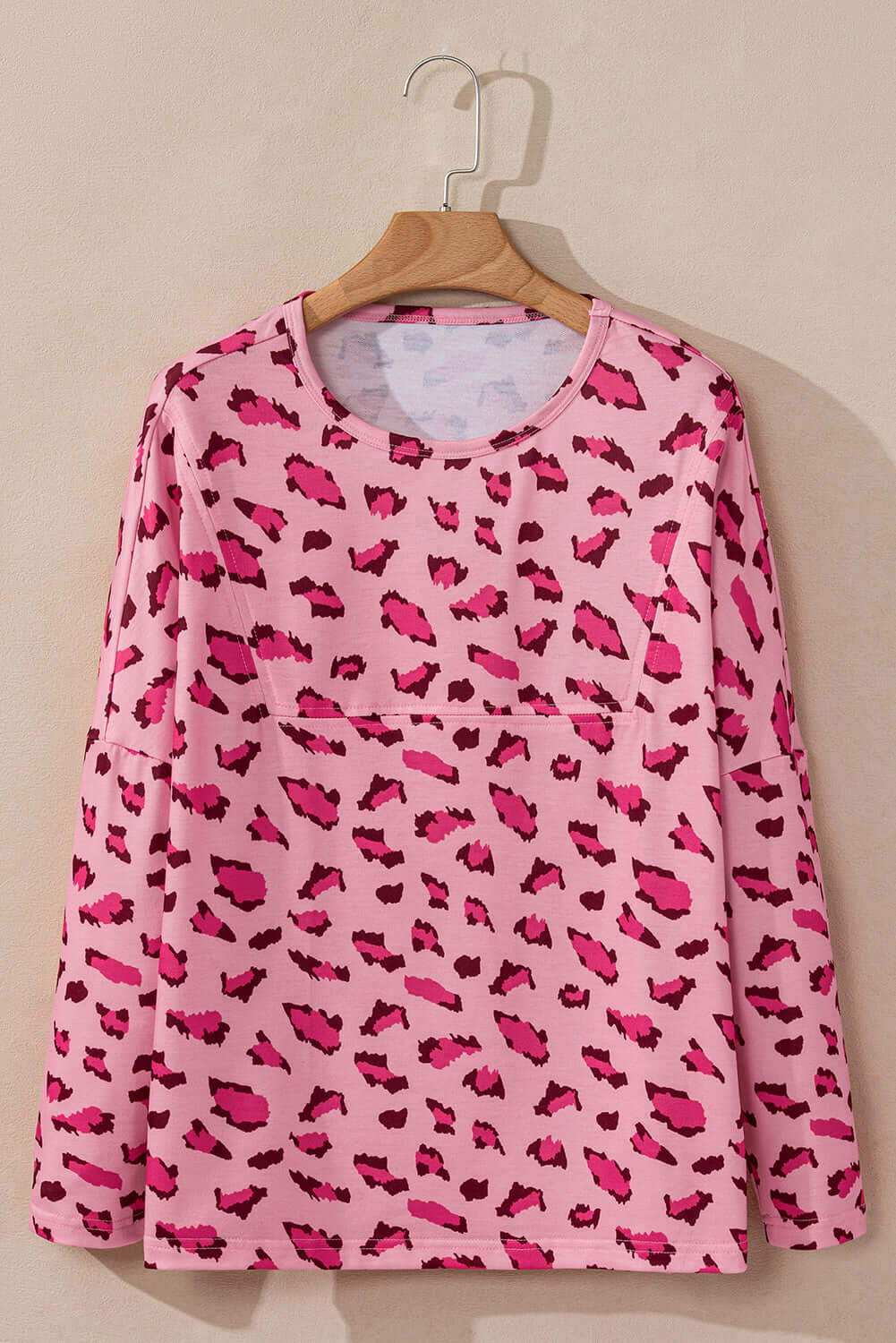 PINK PROWL top by Vivian-Lu featuring a bold leopard print design and relaxed fit long sleeves. Perfect for casual wear.