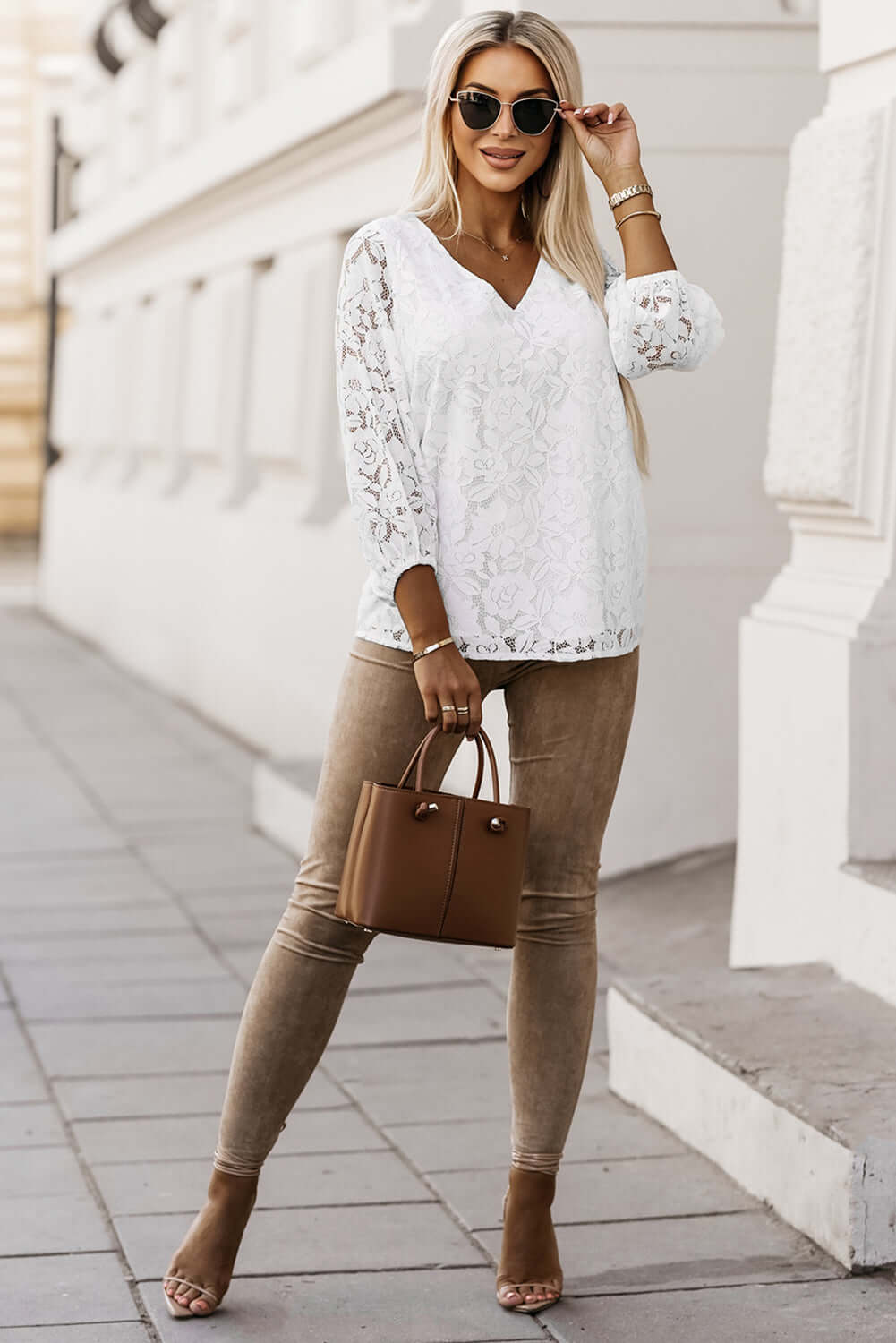 Chic Lace for Days top in white with balloon sleeves, styled with tan pants and sunglasses.