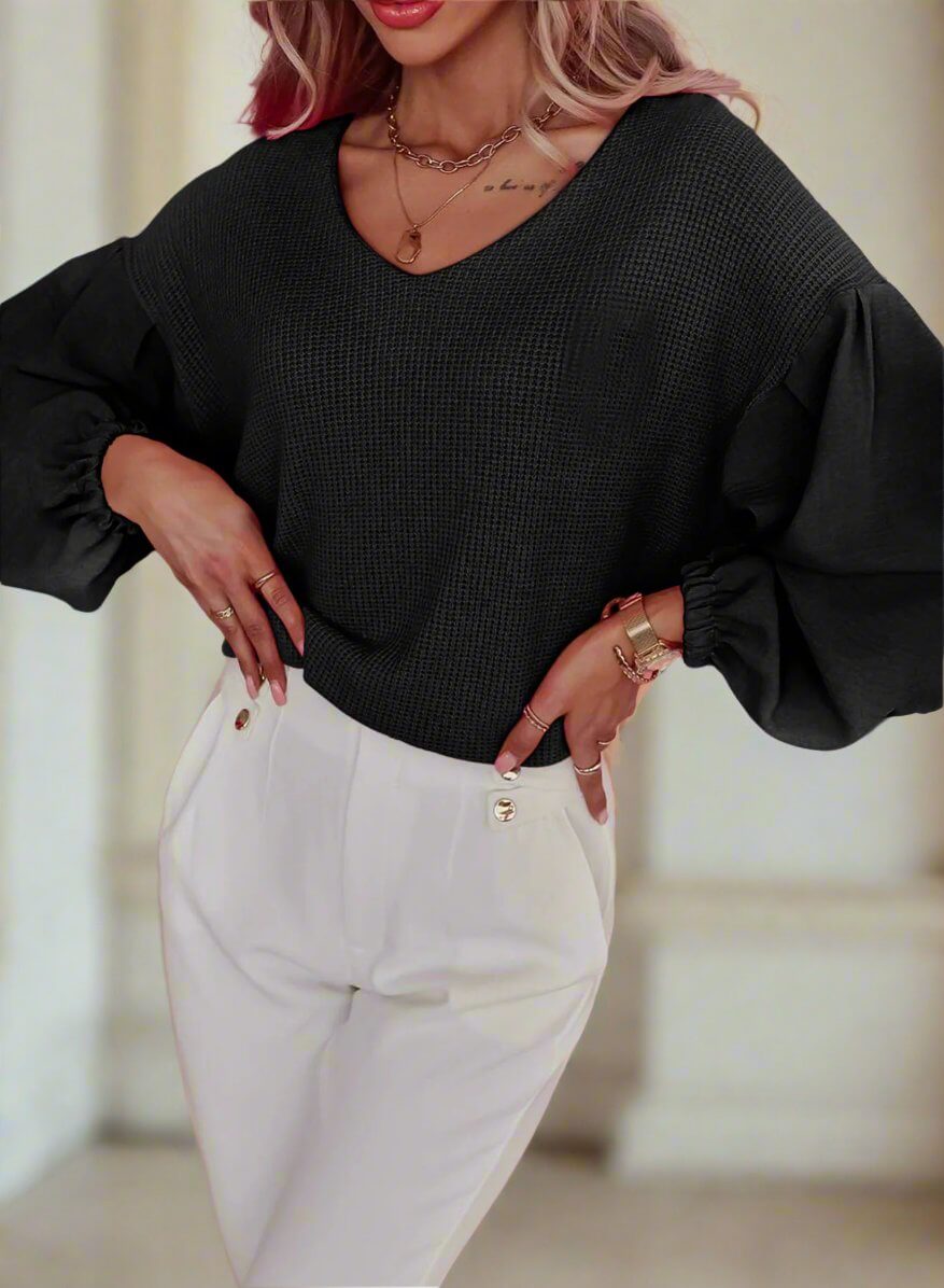 Woman wearing GOING HOME Waffle Knit Top by Vivian-Lu, featuring balloon sleeves and a flattering V-neck in black.