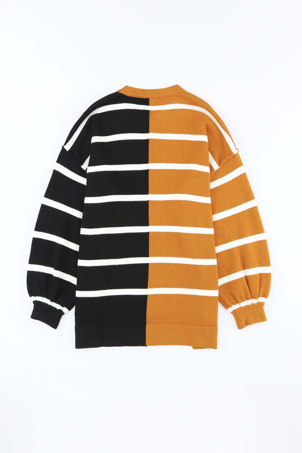 Image of HARVEST SPICE TOP showcasing its oversized design with contrast patchwork stripes in black and mustard.