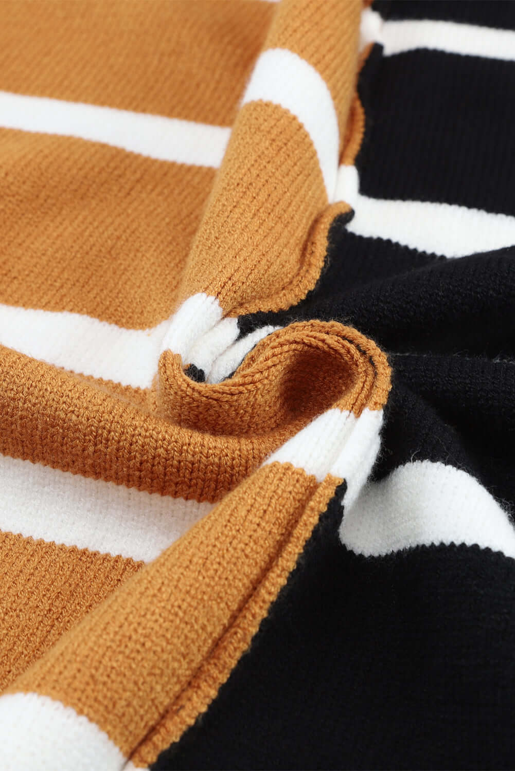 Close-up of the cozy fabric texture and striped pattern of the HARVEST SPICE TOP in warm tones.