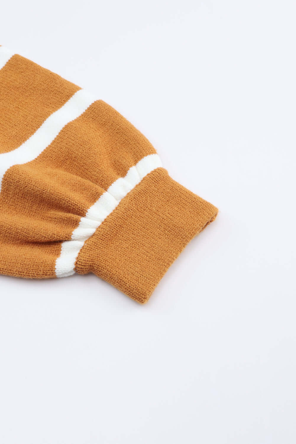 HARVEST SPICE TOP close-up of striped oversized sweater sleeve showing relaxed fit and contrast colors.