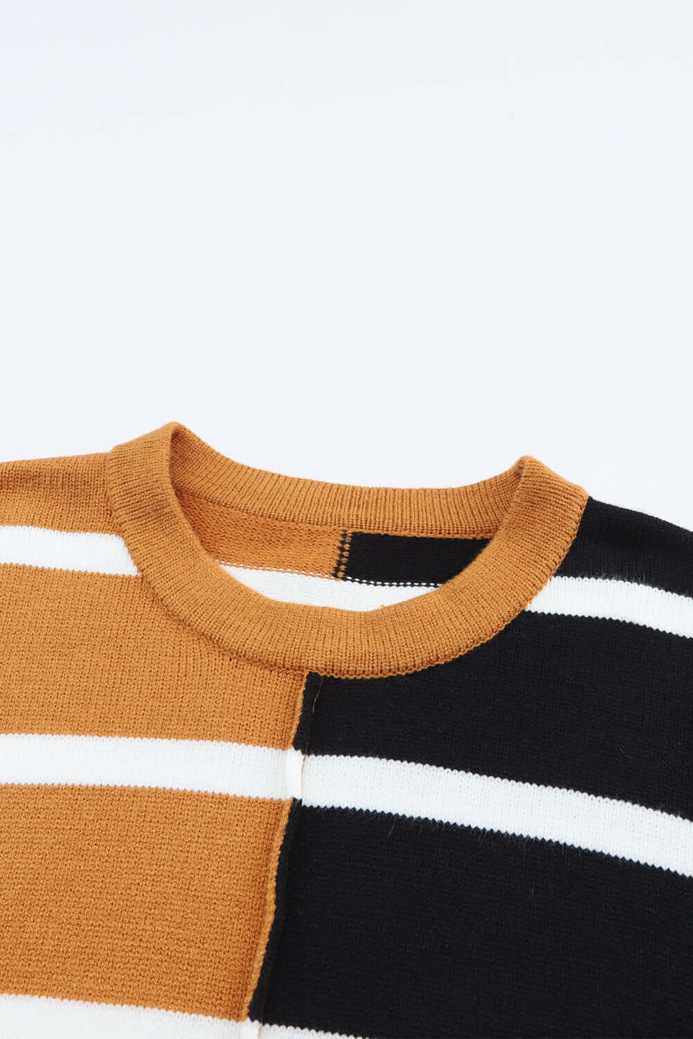 HARVEST SPICE TOP featuring a cozy striped design in warm tones and classic black and white stripes.