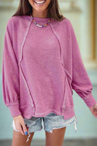 Edgy pink terry top with exposed seam detailing, ideal for casual outings or athletic events.