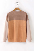 Color block taupe and tan long sleeve top with ribbed texture on hanger, showcasing casual chic style.