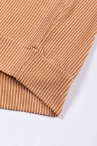 Ribbed texture sleeve of STANDOUT Color Block Top in taupe and tan, showcasing detailed fabric pattern and chic style.