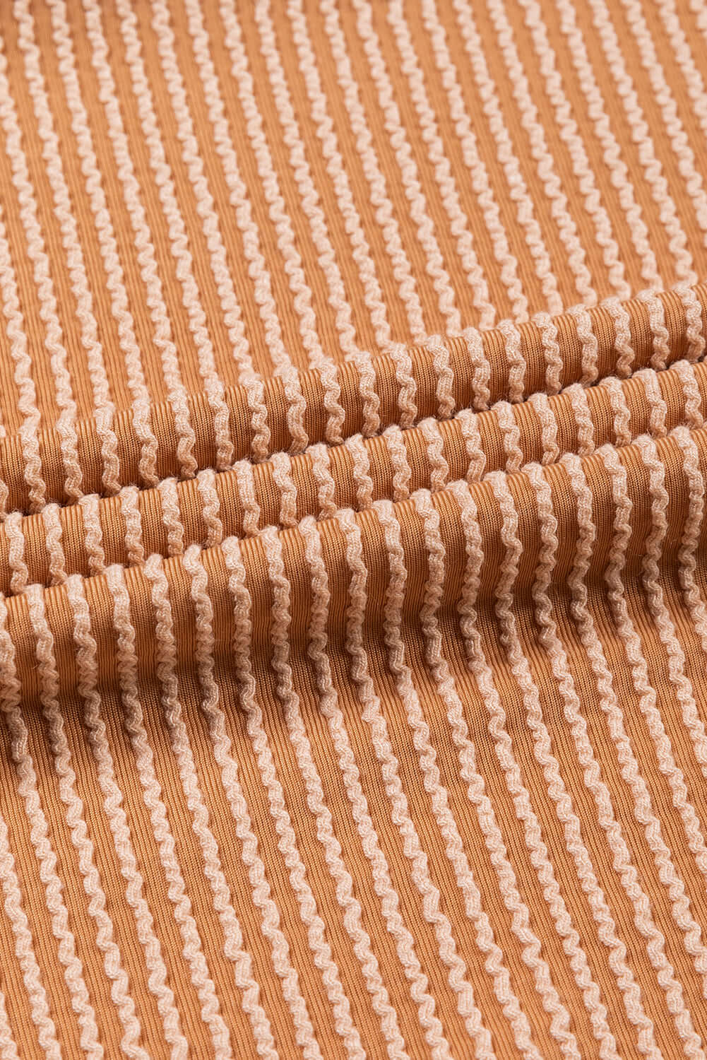 Taupe ribbed texture fabric of STANDOUT Color Block Top showcasing detailed pattern and quality materials.