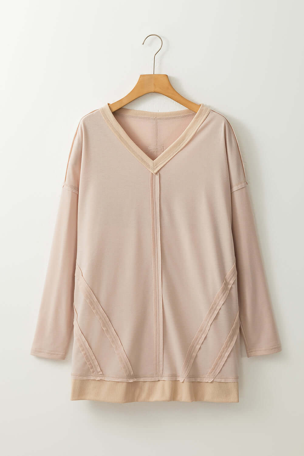 ON MY MIND Top by Vivian-Lu, loose fit tunic with v neck, dropped shoulders, side slits, exposed seam details, blush color, on hanger