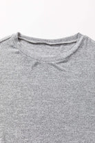 Close-up of the crew neck detail of the WHISPERING MIST TOP in misty gray, showcasing its soft fabric and simple design.