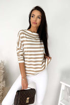 Stylish striped boatneck top by Vivian-Lu paired with white pants, featuring a relaxed fit and soft fabric.