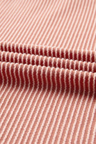 Close-up of ribbed fabric in a red and white striped pattern, showcasing texture and design of the Boho Beauty Top by Vivian-Lu.