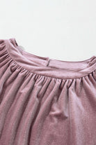 Lilac Luxe Top with pleated round neck and plush velvet fabric close-up.