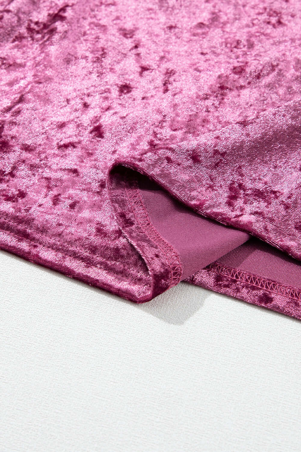 Close-up of rose pink crushed velvet fabric on the Velvet Whisper blouse, featuring soft texture and luxurious sheen.