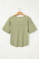 Back view of the sage Carefree Mode Top with relaxed fit and half sleeves, perfect for summer styling.