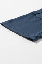 Carefree Mode Top detail in indigo blue showing texture and dropped shoulder design for summer style and comfort.