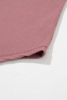 Textured rosewood knit fabric of the Carefree Mode Top, showcasing its soft and airy surface.