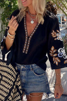 GYPSY SOUL Top – Chic Bohemian Blouse Boutique by Vivian-Lu $42.00 Flaunt your style with this trendy black blouse featuring floral sleeves, intricate embroidery, and ultimate comfort. Perfect for any occasion. Teal Tiger Boutique