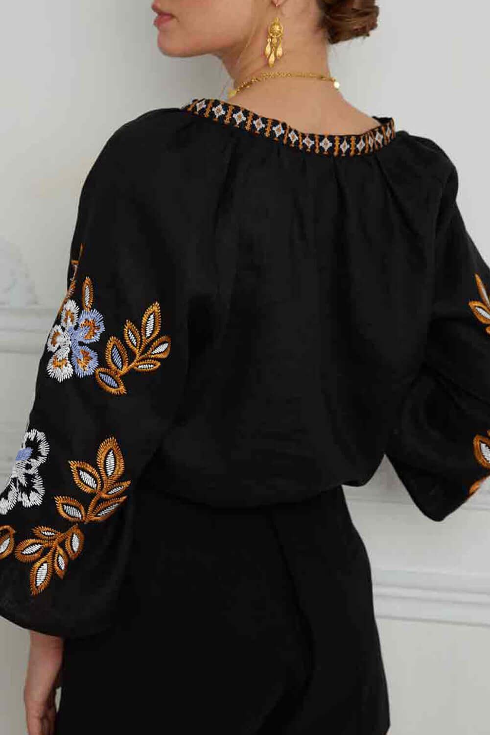 GYPSY SOUL Top – Chic Bohemian Blouse Boutique by Vivian-Lu $42.00 Flaunt your style with this trendy black blouse featuring floral sleeves, intricate embroidery, and ultimate comfort. Perfect for any occasion. Teal Tiger Boutique