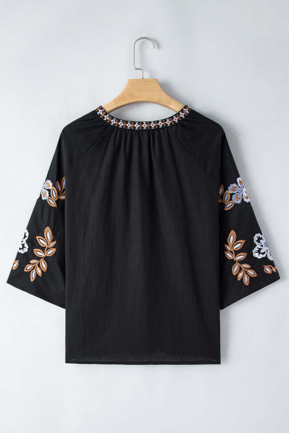 GYPSY SOUL Top – Chic Bohemian Blouse Boutique by Vivian-Lu $42.00 Flaunt your style with this trendy black blouse featuring floral sleeves, intricate embroidery, and ultimate comfort. Perfect for any occasion. Teal Tiger Boutique