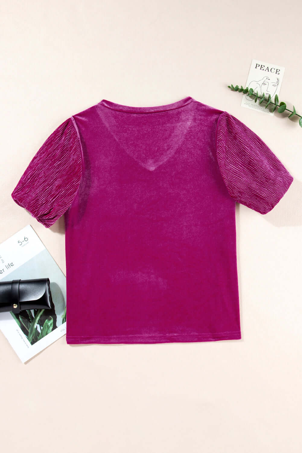 Raspberry Gemtone Top with pleated bubble sleeves in luxurious velvet material, highlighted with a flattering V-neckline.