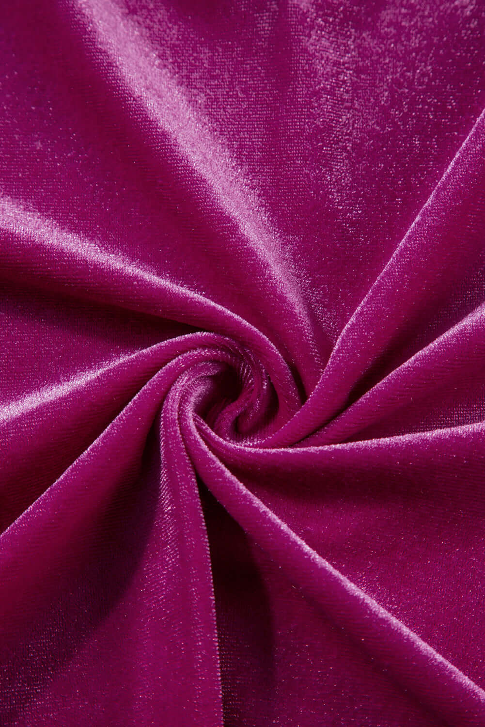 Luxurious raspberry velvet fabric texture with pleated design, highlighting the softness and richness of the material for the Gemtone Top.