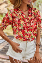 Tropical Tango blouse with vibrant red floral print and bubble sleeves, perfect for summer styling.