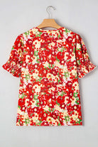Back view of the Tropical Tango red floral bubble sleeve blouse featuring vibrant colors and flattering design.