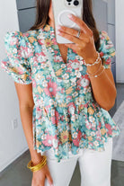 FESTIVAL OF FLOWERS TOP - Trendy & Stylish Boho Blouse by Teal Tiger Boutique $28.00 Elevate your style and comfort with our trendy boutique Festival of Flowers top. Elegant notch neckline, chic puffy sleeves, and a flattering peplum hem! Teal Tiger Bouti