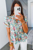 FESTIVAL OF FLOWERS TOP - Trendy & Stylish Boho Blouse by Teal Tiger Boutique $28.00 Elevate your style and comfort with our trendy boutique Festival of Flowers top. Elegant notch neckline, chic puffy sleeves, and a flattering peplum hem! Teal Tiger Bouti